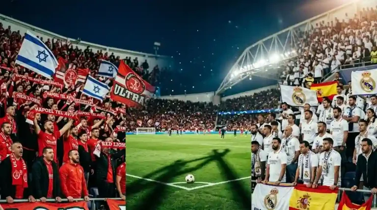 Fotografía del partido hapoel tel aviv - real madrid con afición y estadio iluminado.